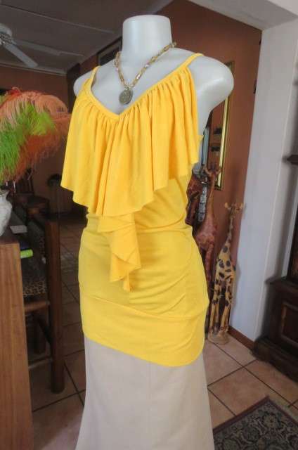 Seriously sexy long buttercup yellow top size 32/8. In polyester/rayon with some stretch.As new