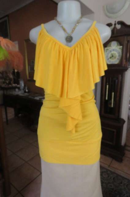 Seriously sexy long buttercup yellow top size 32/8. In polyester/rayon with some stretch.As new