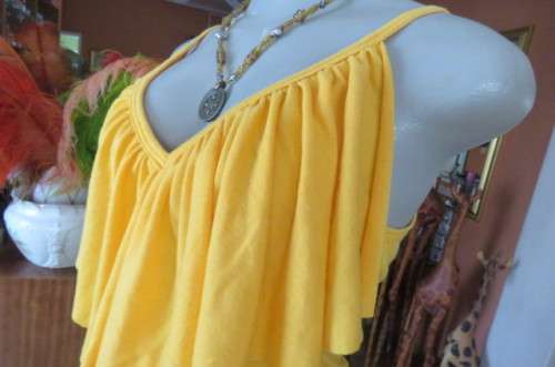 Seriously sexy long buttercup yellow top size 32/8. In polyester/rayon with some stretch.As new