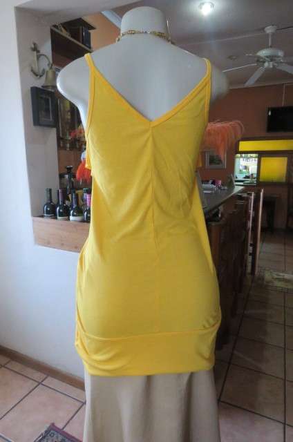 Seriously sexy long buttercup yellow top size 32/8. In polyester/rayon with some stretch.As new