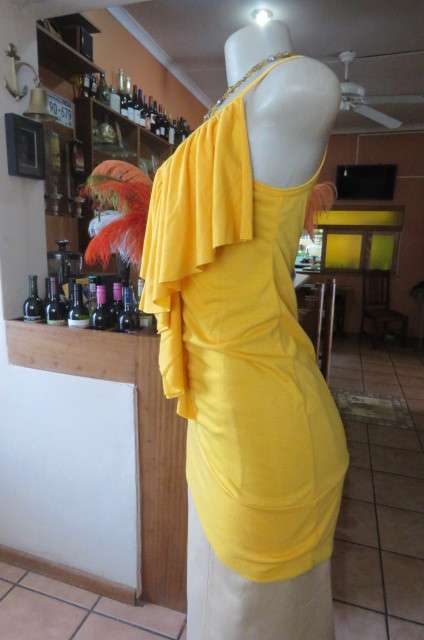 Seriously sexy long buttercup yellow top size 32/8. In polyester/rayon with some stretch.As new