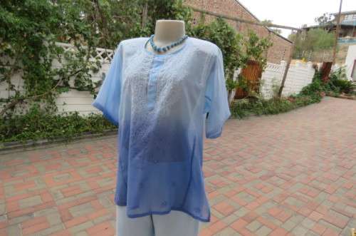 Embellished short sleeve top in different blue colours. Size 40/16. In sheer polyester. As new