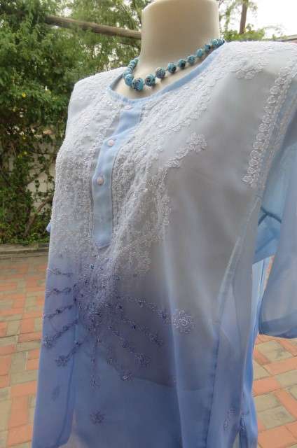 Embellished short sleeve top in different blue colours. Size 40/16. In sheer polyester. As new