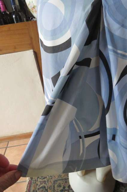 Geometric printed kneelength skirt in blues,cream and black by JEEP in size 42/18