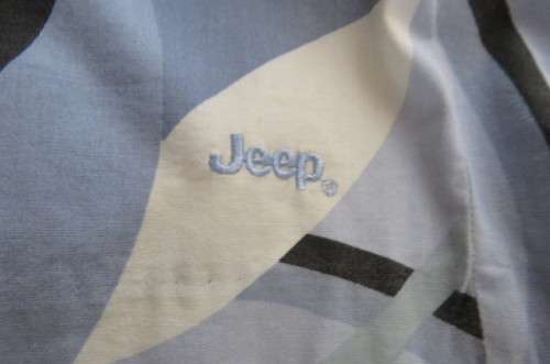 Geometric printed kneelength skirt in blues,cream and black by JEEP in size 42/18