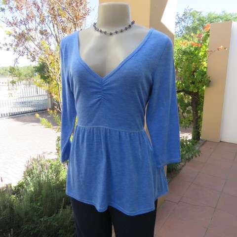 Skyblue peplum top by HOLLISTER Californiain size 38/14. Wide neckline with V front. Soft fabric.