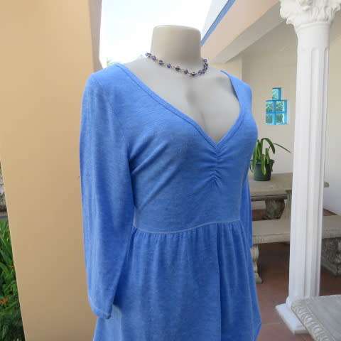 Skyblue peplum top by HOLLISTER Californiain size 38/14. Wide neckline with V front. Soft fabric.