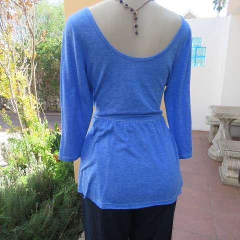 Skyblue peplum top by HOLLISTER Californiain size 38/14. Wide neckline with V front. Soft fabric.