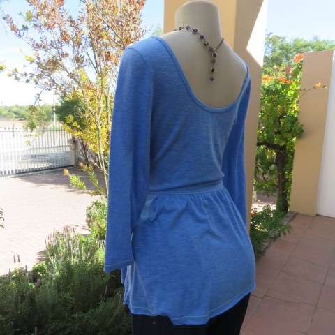 Skyblue peplum top by HOLLISTER Californiain size 38/14. Wide neckline with V front. Soft fabric.