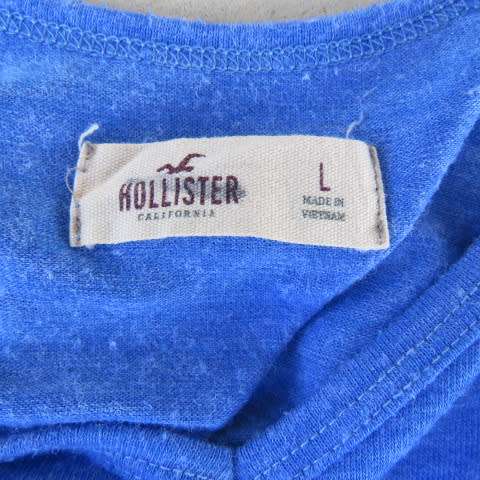 Skyblue peplum top by HOLLISTER Californiain size 38/14. Wide neckline with V front. Soft fabric.