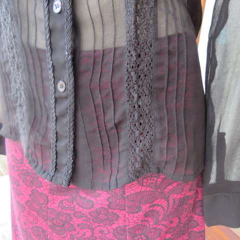 Dainty long sleeve black sheer polyester top made for OASIS in India. With lace inlays on front.