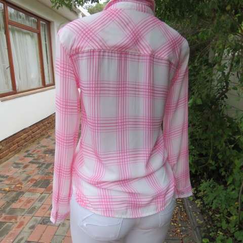 Soft and silky white and pink check long sleeve blouse in 100% polyester chiffon. Size 30 As new