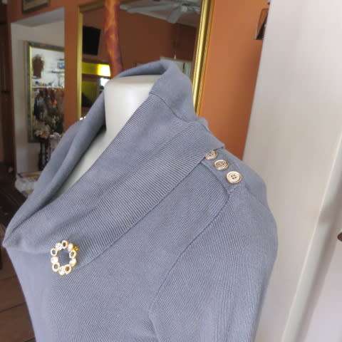 Wide poloneck knitted grey dress that will never date.In size 34/10 by NEW FEELING. As new.