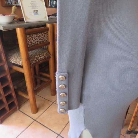 Wide poloneck knitted grey dress that will never date.In size 34/10 by NEW FEELING. As new.