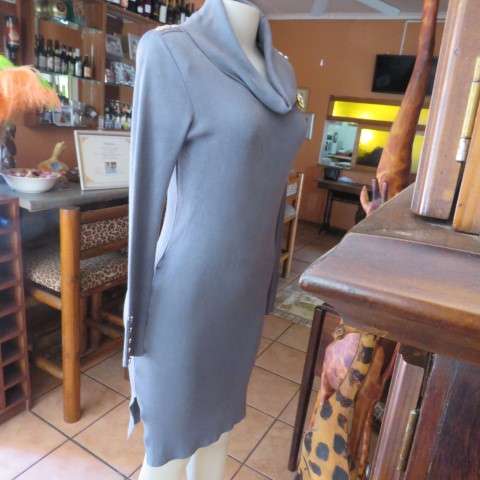 Wide poloneck knitted grey dress that will never date.In size 34/10 by NEW FEELING. As new.