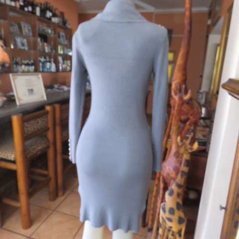 Wide poloneck knitted grey dress that will never date.In size 34/10 by NEW FEELING. As new.