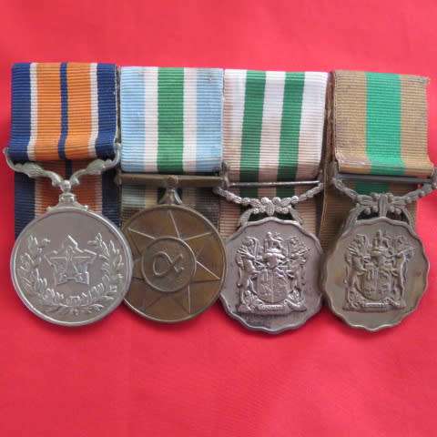 Set of 4 SADF medals with ribbons. General Service...Bronz 1994 service..Silver good service..5yr