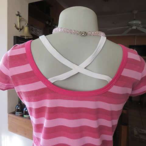 Sexy little capped sleeve top in horizontal stripes in pinks.Scooped neckline. Size 32/8.As new