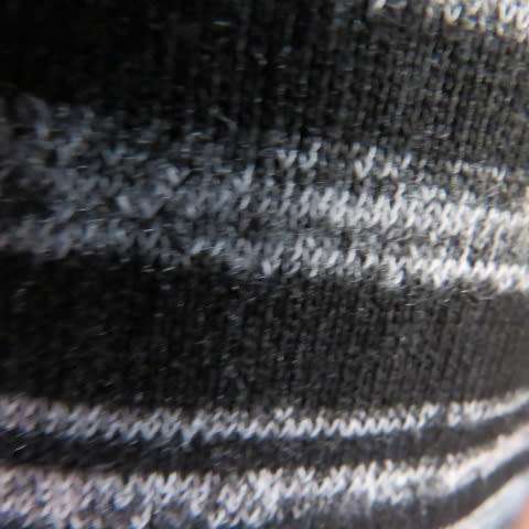 Black and white horizontal striped sleeveless coat with long slitted sides. Size 32/8 by AMARA