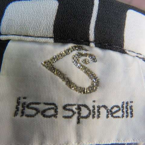 Black and white square patterned top by 'Lisa Spinelli' size 34/10. Elbow length sleeves. As new.