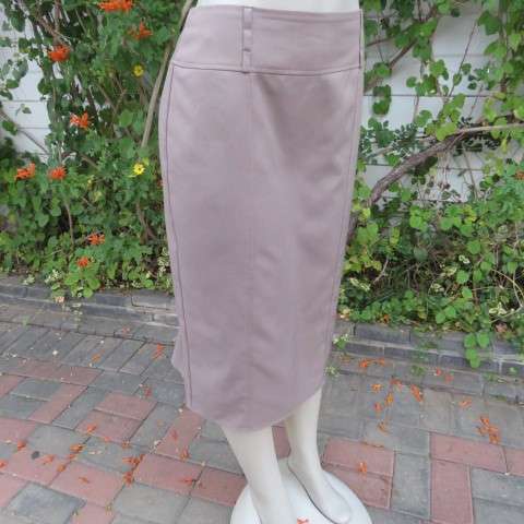 High quality calf length fully lined khaki colour skirt. Styled to perfection by Peter B` size 36/12