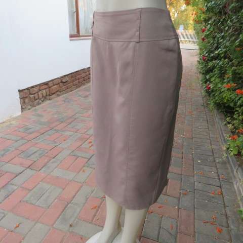 High quality calf length fully lined khaki colour skirt. Styled to perfection by Peter B` size 36/12