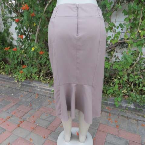 High quality calf length fully lined khaki colour skirt. Styled to perfection by Peter B` size 36/12