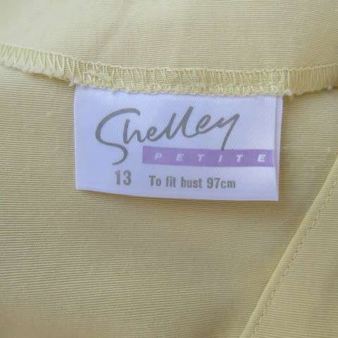 Top of the line corn colour vintage dress by 'Shelley' in size 37/13. As new.