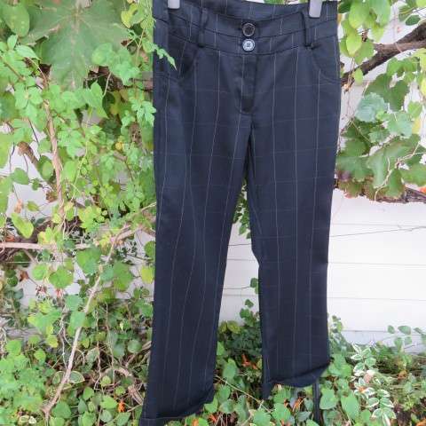 Beautiful black pants with large white check pattern.Yoked back.Size 31/7. Bootlegged. New cond.