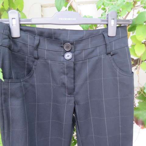 Beautiful black pants with large white check pattern.Yoked back.Size 31/7. Bootlegged. New cond.