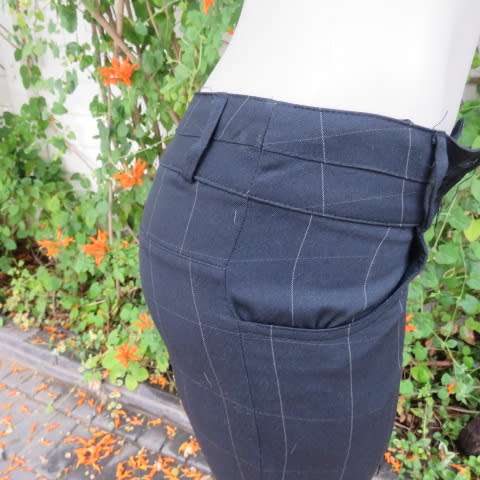 Beautiful black pants with large white check pattern.Yoked back.Size 31/7. Bootlegged. New cond.