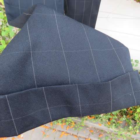 Beautiful black pants with large white check pattern.Yoked back.Size 31/7. Bootlegged. New cond.