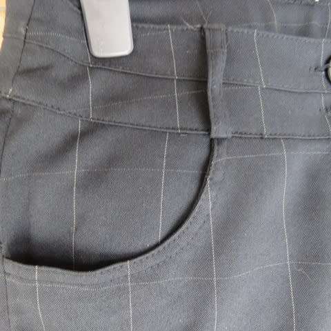 Beautiful black pants with large white check pattern.Yoked back.Size 31/7. Bootlegged. New cond.