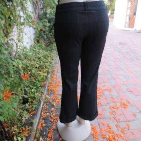 Beautiful black pants with large white check pattern.Yoked back.Size 31/7. Bootlegged. New cond.
