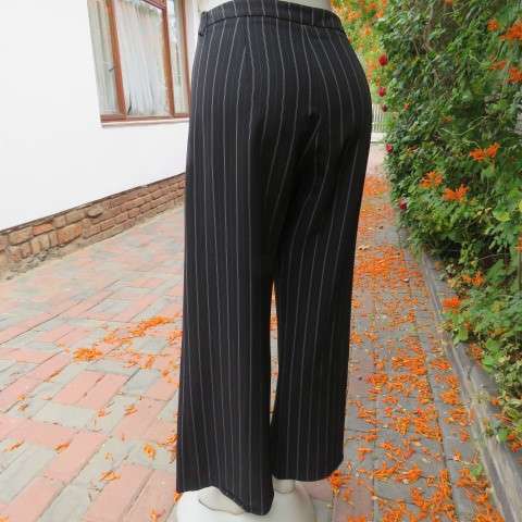 Fashionable wide legged black and white vertical striped pants in size 37/13 by DEFINE.As new.