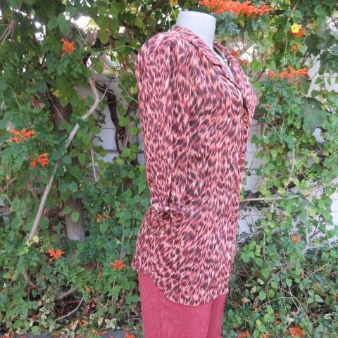 Pretty animal print top in brown colours by Kelso in size 34/10. Button down front with open collar.