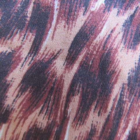 Pretty animal print top in brown colours by Kelso in size 34/10. Button down front with open collar.