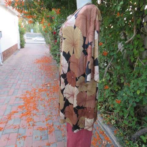 Silky dark brown slip over top with bold beige,gold and brown floral pattern. Short sleeves. Size 50