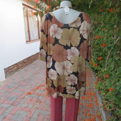 Silky dark brown slip over top with bold beige,gold and brown floral pattern. Short sleeves. Size 50