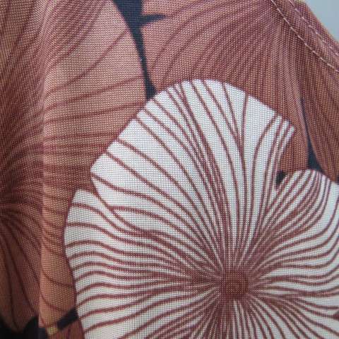 Silky dark brown slip over top with bold beige,gold and brown floral pattern. Short sleeves. Size 50
