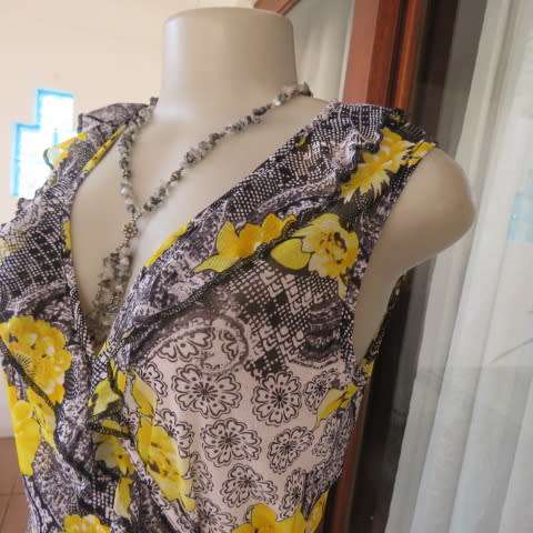 Seriously sexy foldover top in 100% nylon. In black,white and yellow pattern.Size 36/12 by KELSO