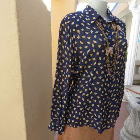 Absolute stunning long sleeve blouse from Germany in size 38/14 in navy with golden leaves. New cond