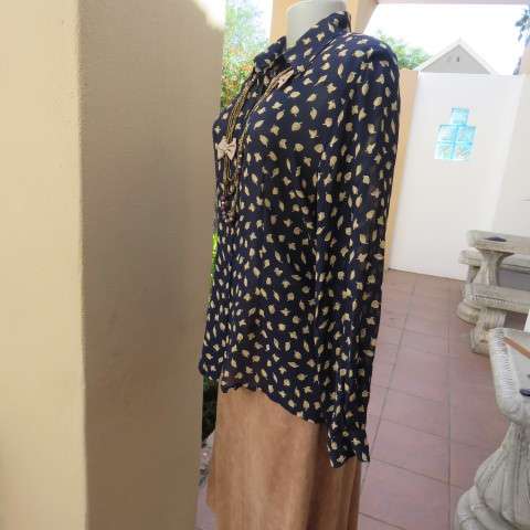 Absolute stunning long sleeve blouse from Germany in size 38/14 in navy with golden leaves. New cond