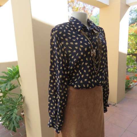 Absolute stunning long sleeve blouse from Germany in size 38/14 in navy with golden leaves. New cond