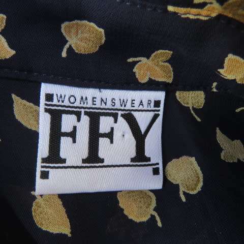 Absolute stunning long sleeve blouse from Germany in size 38/14 in navy with golden leaves. New cond