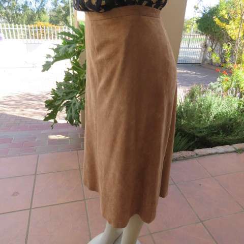 Smart A-Line calf length suede look camel skirt with seam at back and front. Zip at back.Size 42/18