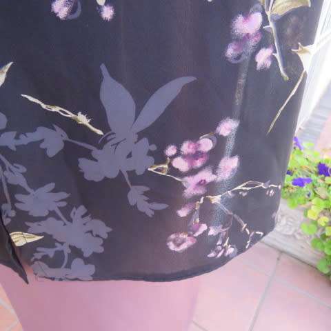 Pretty black sheer polyester long sleeve top with lilac,grey and green flowers. Size 42/18.Good cond