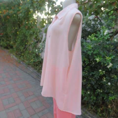 Stunning long sheer polyester peach colour top. Button down with embellished shirt collar.Size 44/20