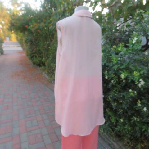 Stunning long sheer polyester peach colour top. Button down with embellished shirt collar.Size 44/20