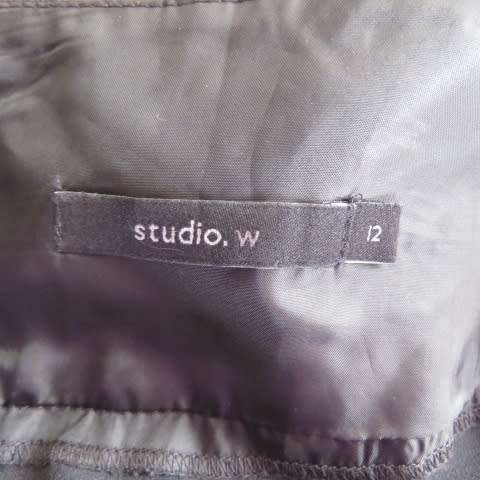 Must have smart black midi skirt with wide yoked waist with bow on left.Size 36/12 by STUDIO W.